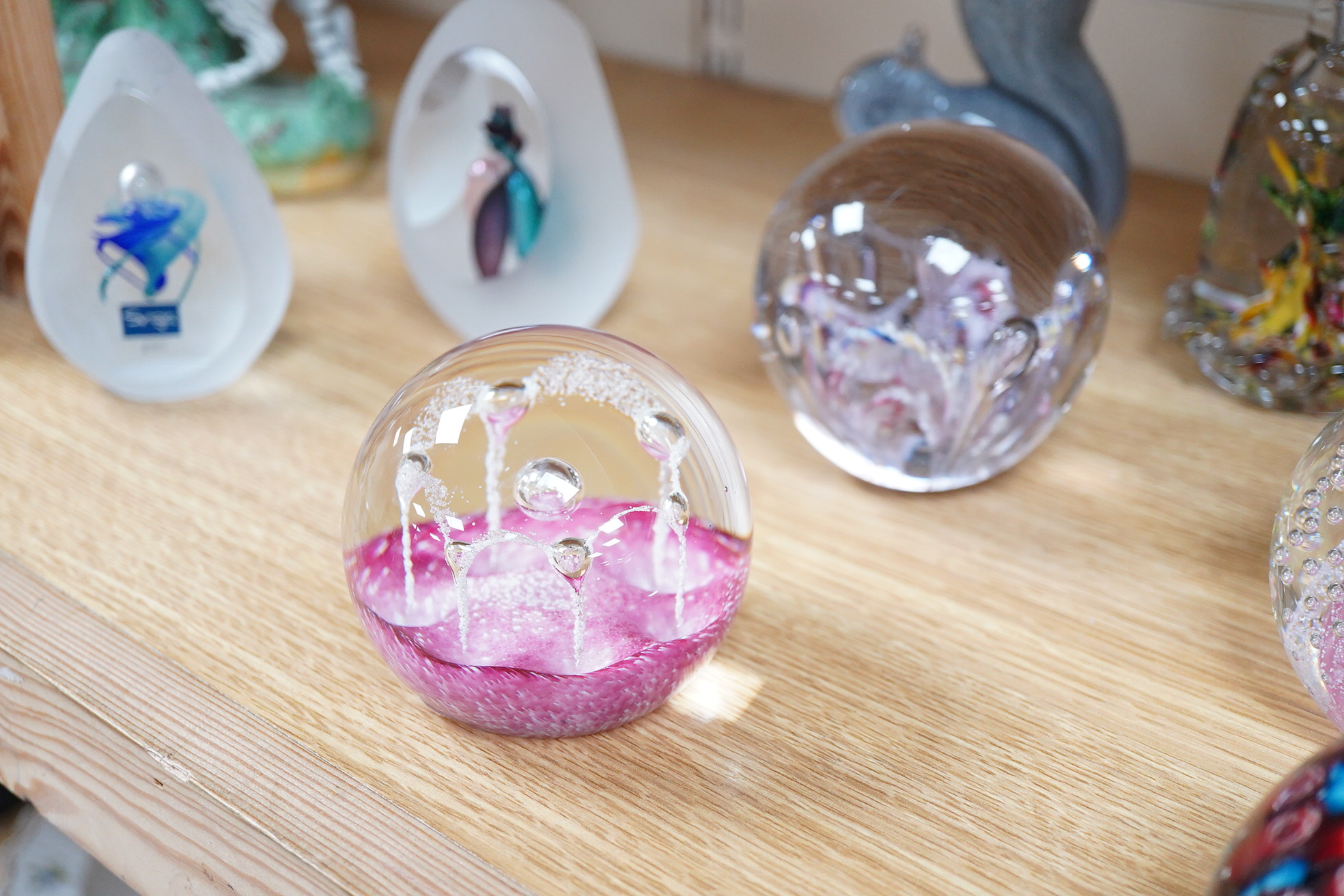 A large collection of 20th century paperweights to include Svaja, Mdina and some novelty examples in the form of animals, largest 27cm high